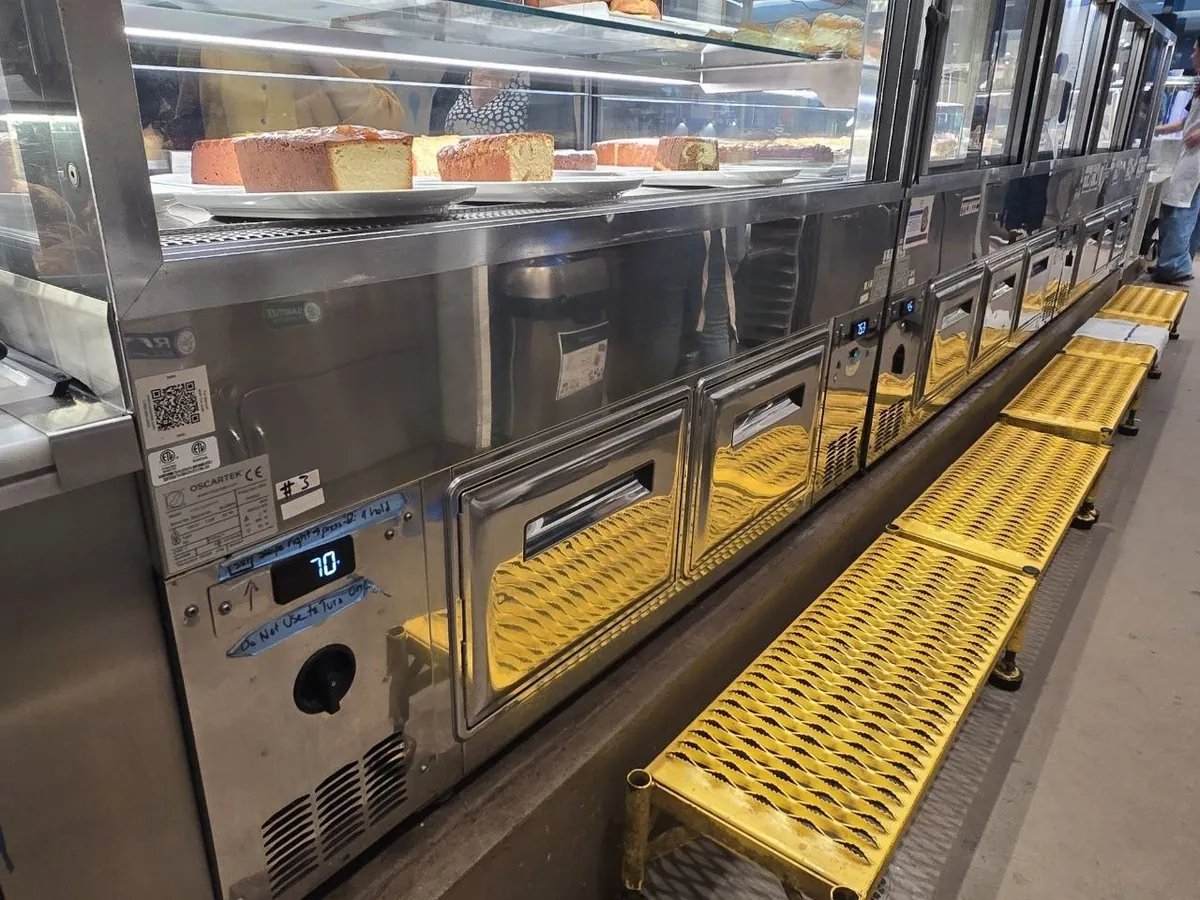 Refrigerated display case on a commercial service line