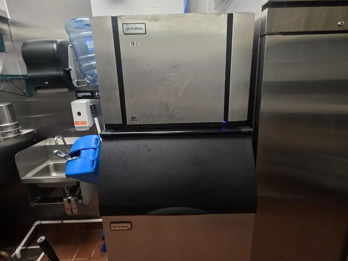 Commercial ice machine head and storage bin in a Bay Area kitchen