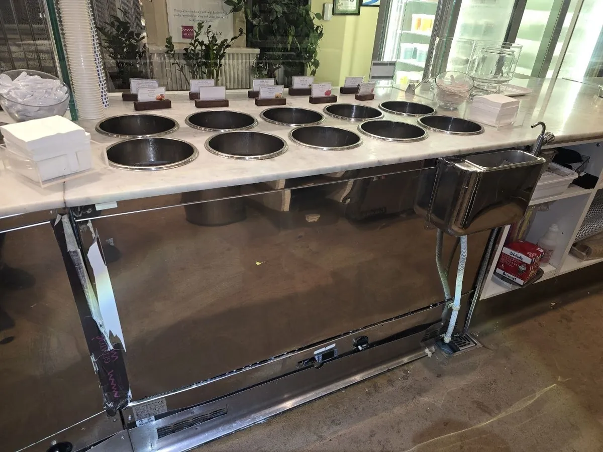 Stainless steam table and serving line in a commercial kitchen
