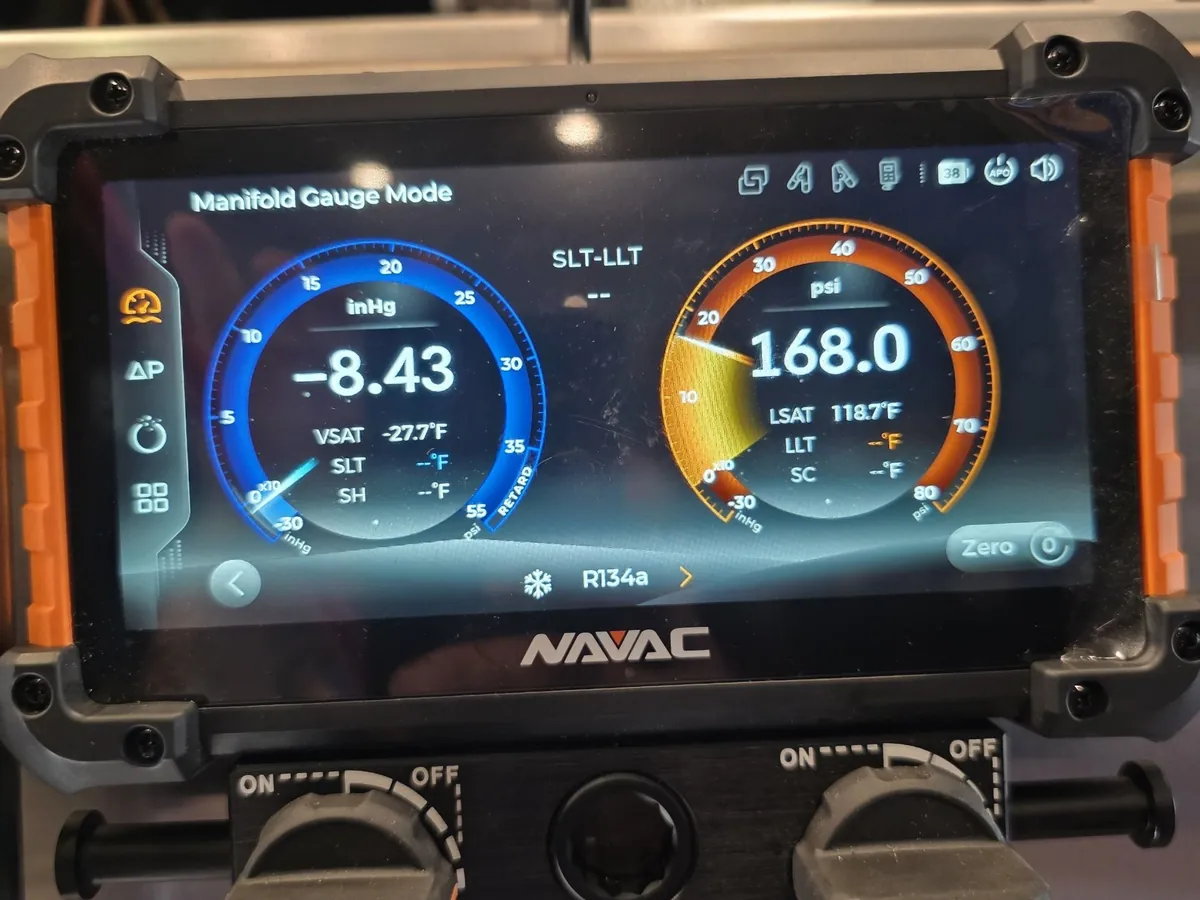Digital manifold showing suction in a vacuum against 168 psi head pressure