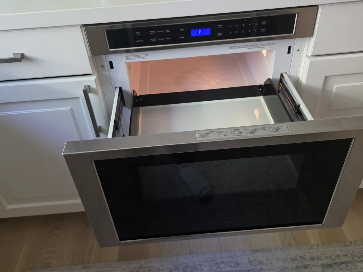 Microwave drawer open in a Bay Area kitchen island