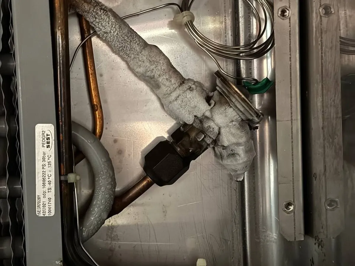 Refrigerant lines and valves inside a service cabinet