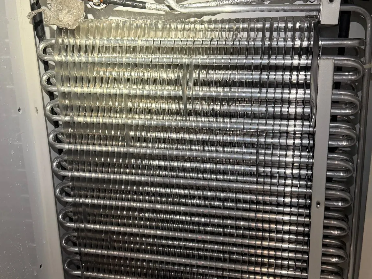 Evaporator assembly removed from a commercial refrigeration unit
