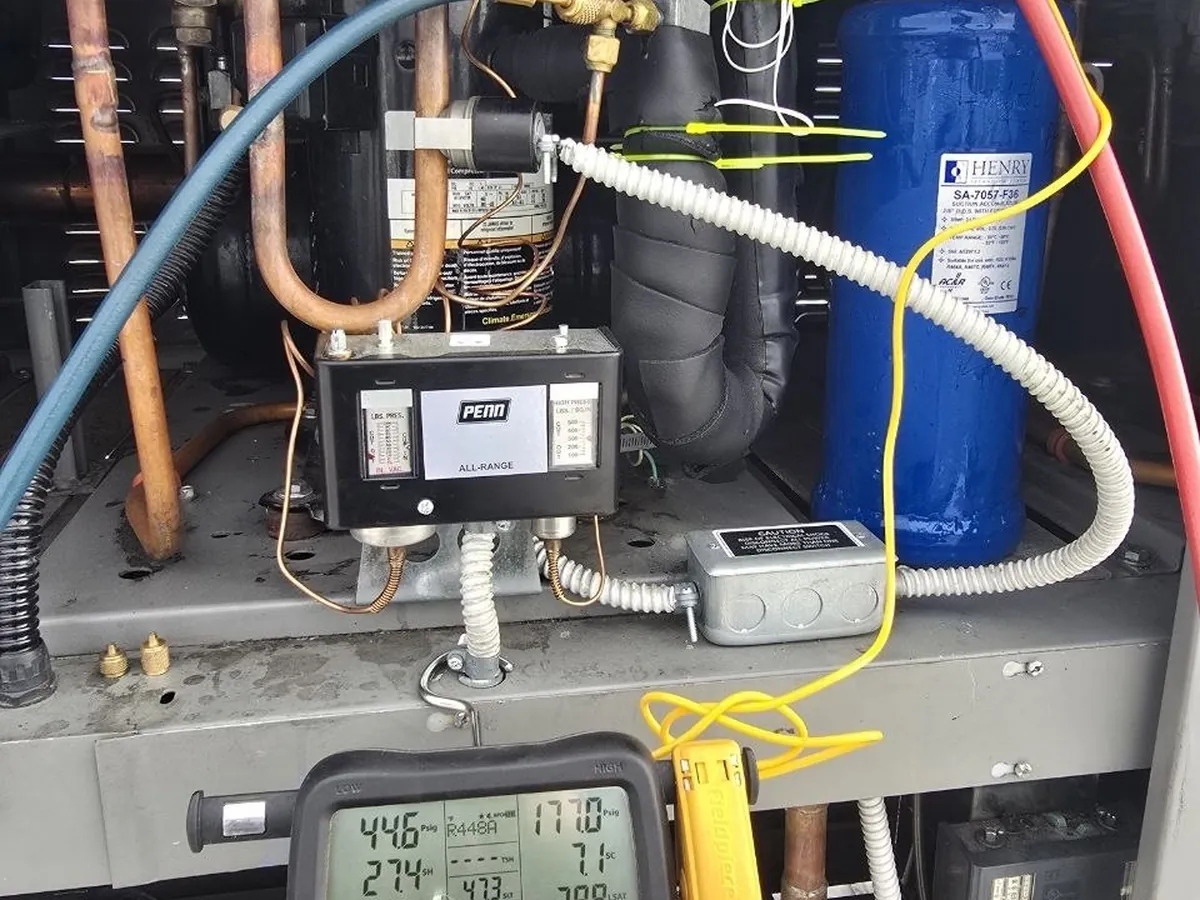 Digital manifold connected to a refrigeration system during diagnosis