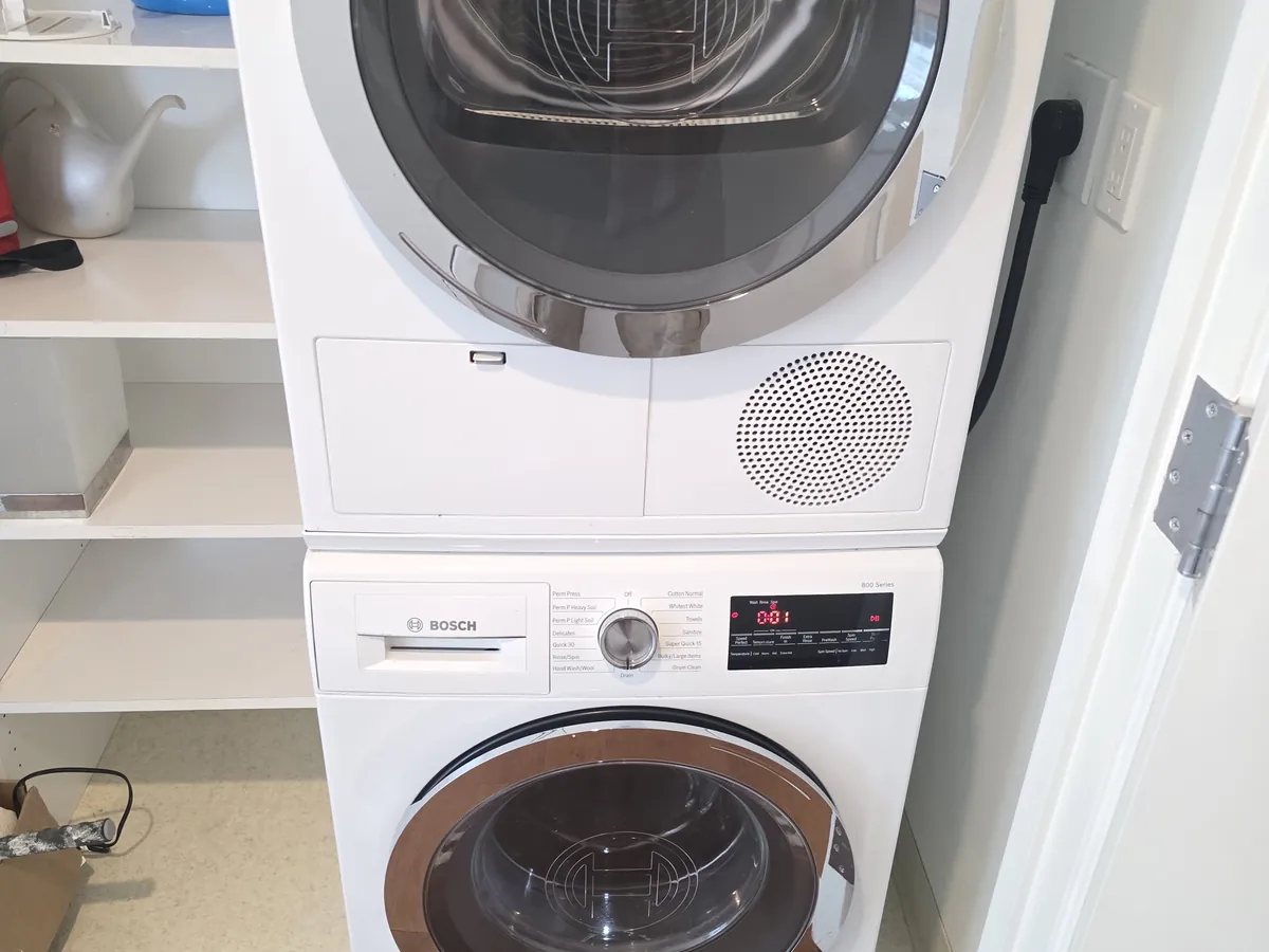 Bosch washer and dryer stacked in a Bay Area laundry