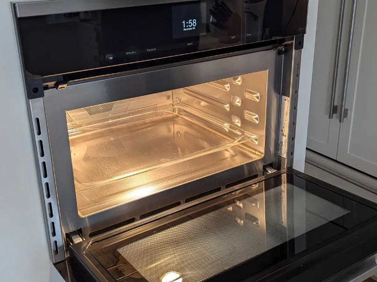 Miele wall oven with the door open in a Bay Area kitchen